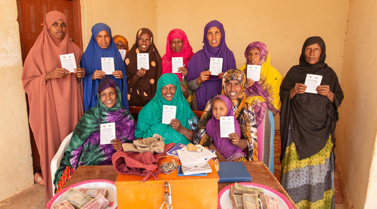 EARO Resource Trip Somalia

Day 3 Sunday 1 April – INTERVIEW #1
LOCATION Ceelsame village, Odweyne district, Todgheer region, Somaliland, north-west Somalia
Note Ceelsame is pronounced ‘El-Sammy’
PROJECT DFAT-funded
‘Somalia Resilience Programme (SomReP): Enhancing resilience in Somalia’
INTERVIEWEE (FEMALE) Kins Nuur Abdulah – VSLA (Village Savings & Loan Association) Chairwoman
INTERVIEWEE wearing: green sarong/scarf
INTERVIEW LOCATION: Primary school at Ceelsame village – group interview with main input from chairwoman.

DISCUSSED
35 members – established in 2015.
Income earned from different sources (tea selling, milk, goats)
Cash-for-Work activities (USD75 per person earned and put into savings box) – ie growing seedlings. Money used for school fees, food, and to support others
eg relatives who having difficult time. Example of group gathering money to help a woman (for food and medicine) who recently gave birth.
Working as a group is empowering, putting money together can do a lot. Help each other in other ways (home decorating with traditional materials, delivering babies) and also work on awareness raising on health subjects such as immunisation, breastfeeding, rubbish collection.
Loans from VSLA given for bakery set up (son of VLSA member), store, ice cream shop.
Use of VLSA funds for emergencies such as for pregnant women taken for medical attention.
Camel milk processing store set up by VLSA members – sold in Ceelsame and also set to Burao. Barter/exchange also done for camel milk.
Profit from camel milk – use for expenses (office/store, machines, guard for store, staff payment, savings for group).
Impact on community (from camel milk processing) – increase income of 10-20%.
Change in community: benefit of having VLSA – group contributed to teacher’s salary so that local school could re-open.
Change for women due to VSLA: economic growth, mindset change.
Future plans: extension of current businesses
Community change: men were s
